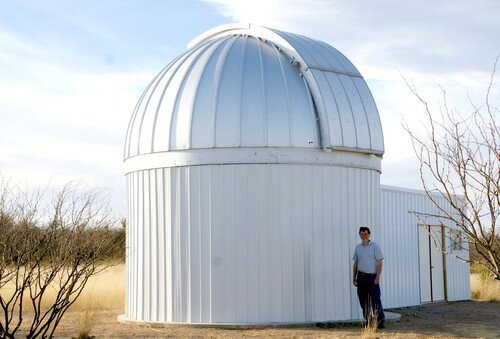 Thomas G. Kaye standing next to the Raemor Vista Observatory in southeastern Arizona USA. This telescope provides rapid response optical followup for newly discovered astronomical objects. It is currently being upgraded to a 1.1 metre telescope. Image Credit: Thomas G Kaye.
