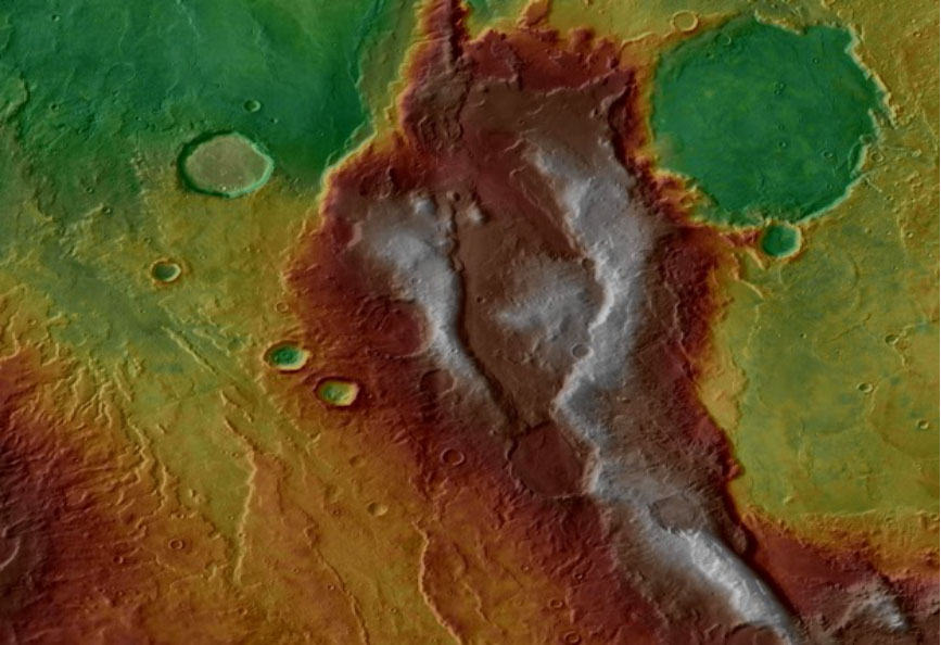 Topographic data are draped over infrared image data showing complex tectonic structures and volcanic deposits in the Eridania region of Mars. Warm colours are higher elevation. Image Credit: NASA/Mars Odyssey/HRSC.